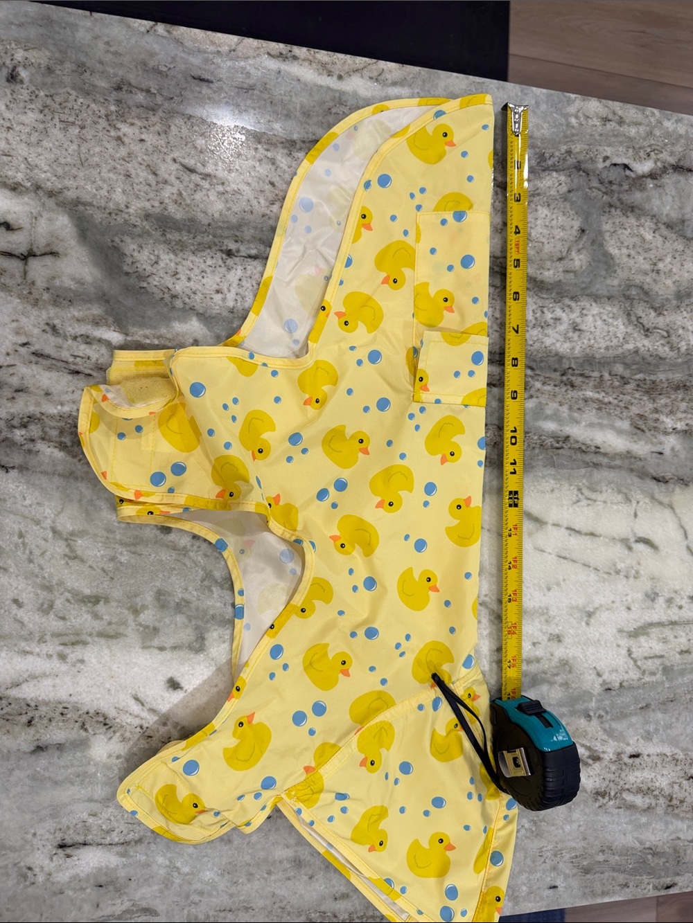 Canada Pooch Limited rain coat with pocket and adjustable hood leash hole